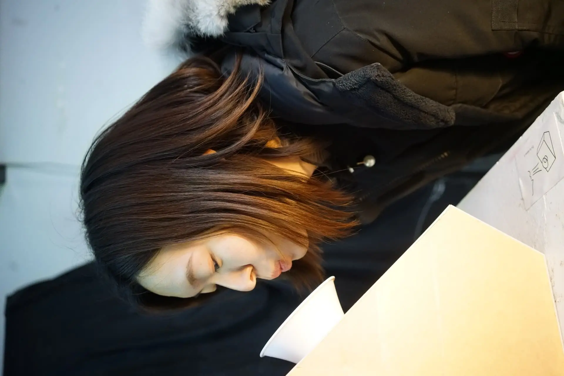 Close-up of visitor blowing into the device