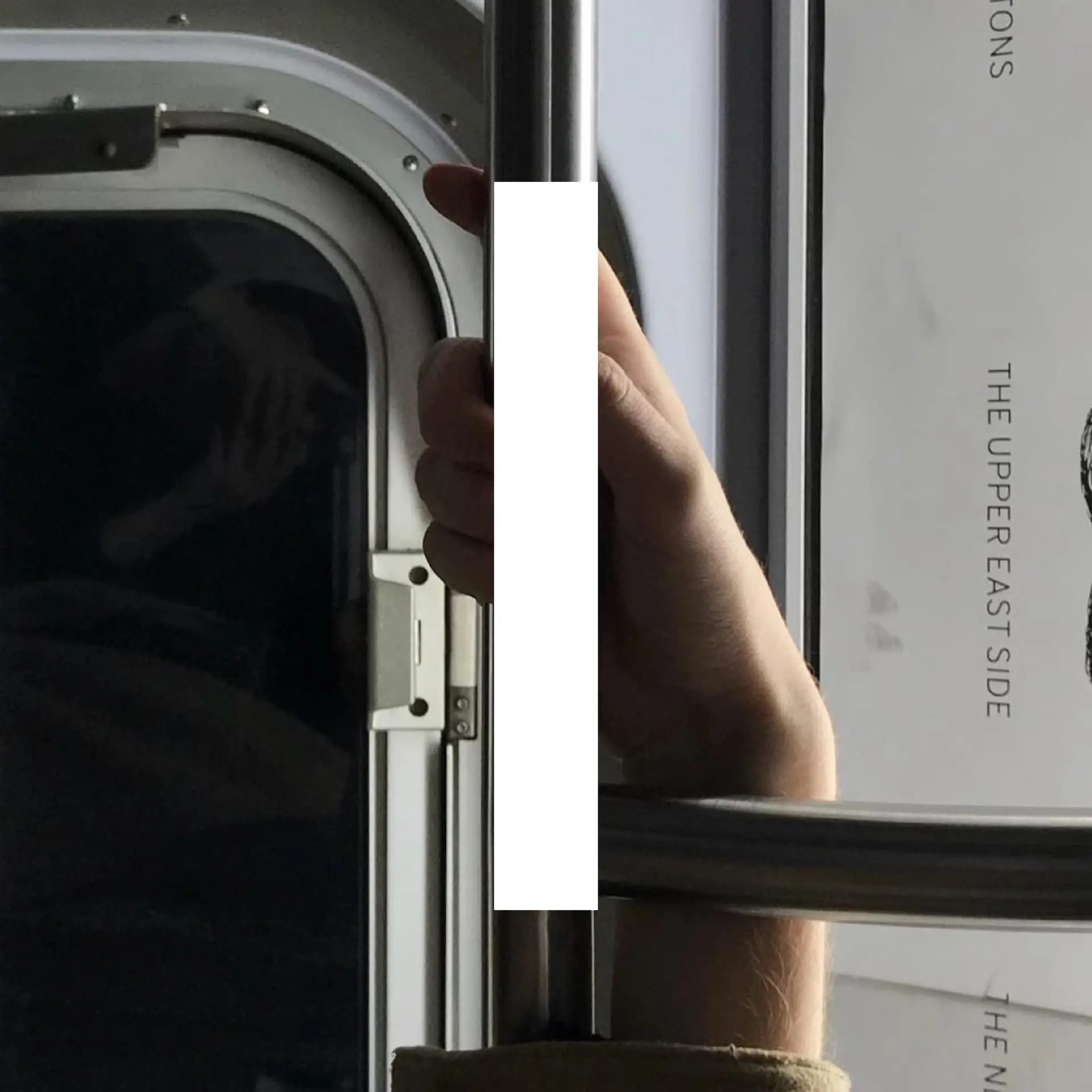 Book spread — hand on door handle