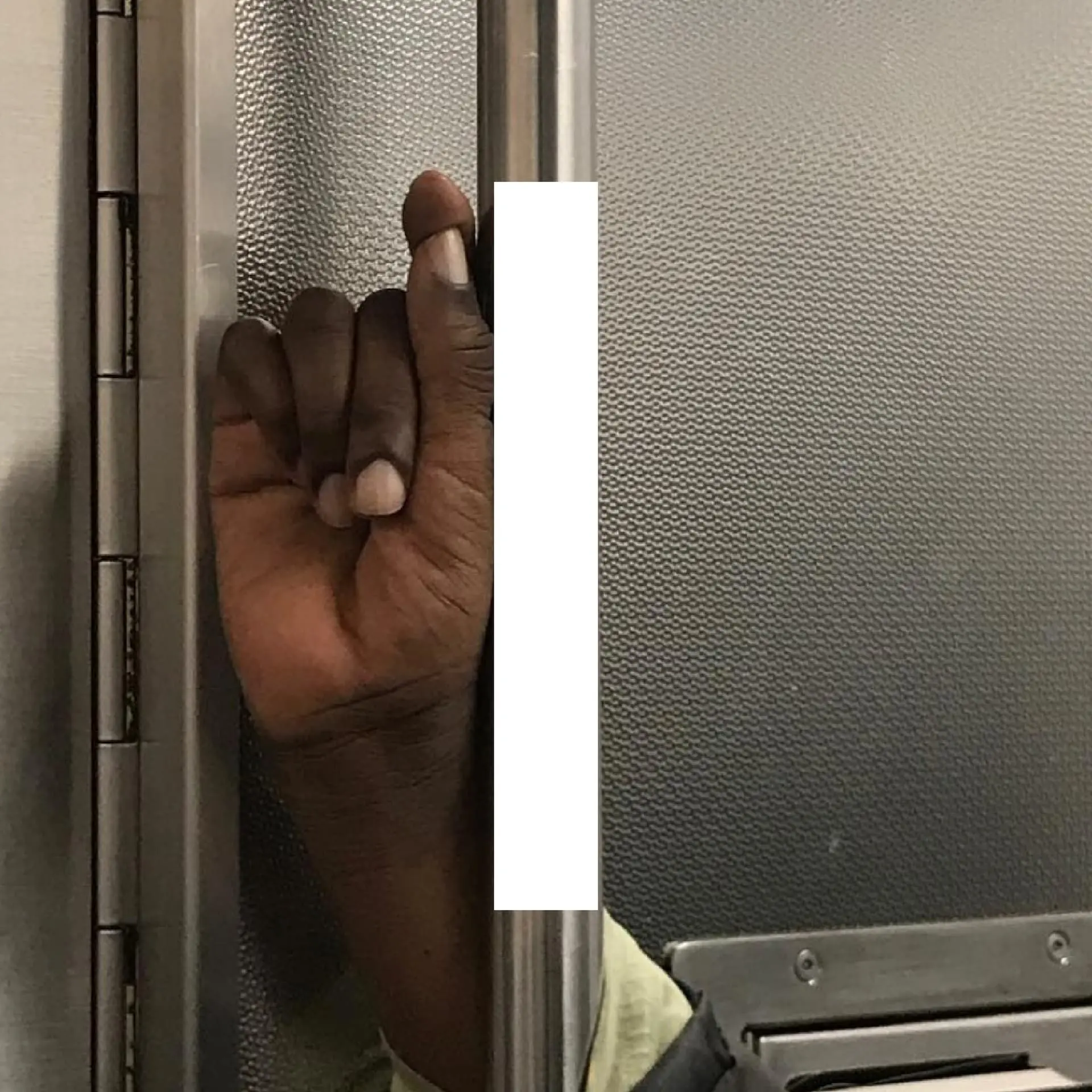 Book spread — hand gripping pole