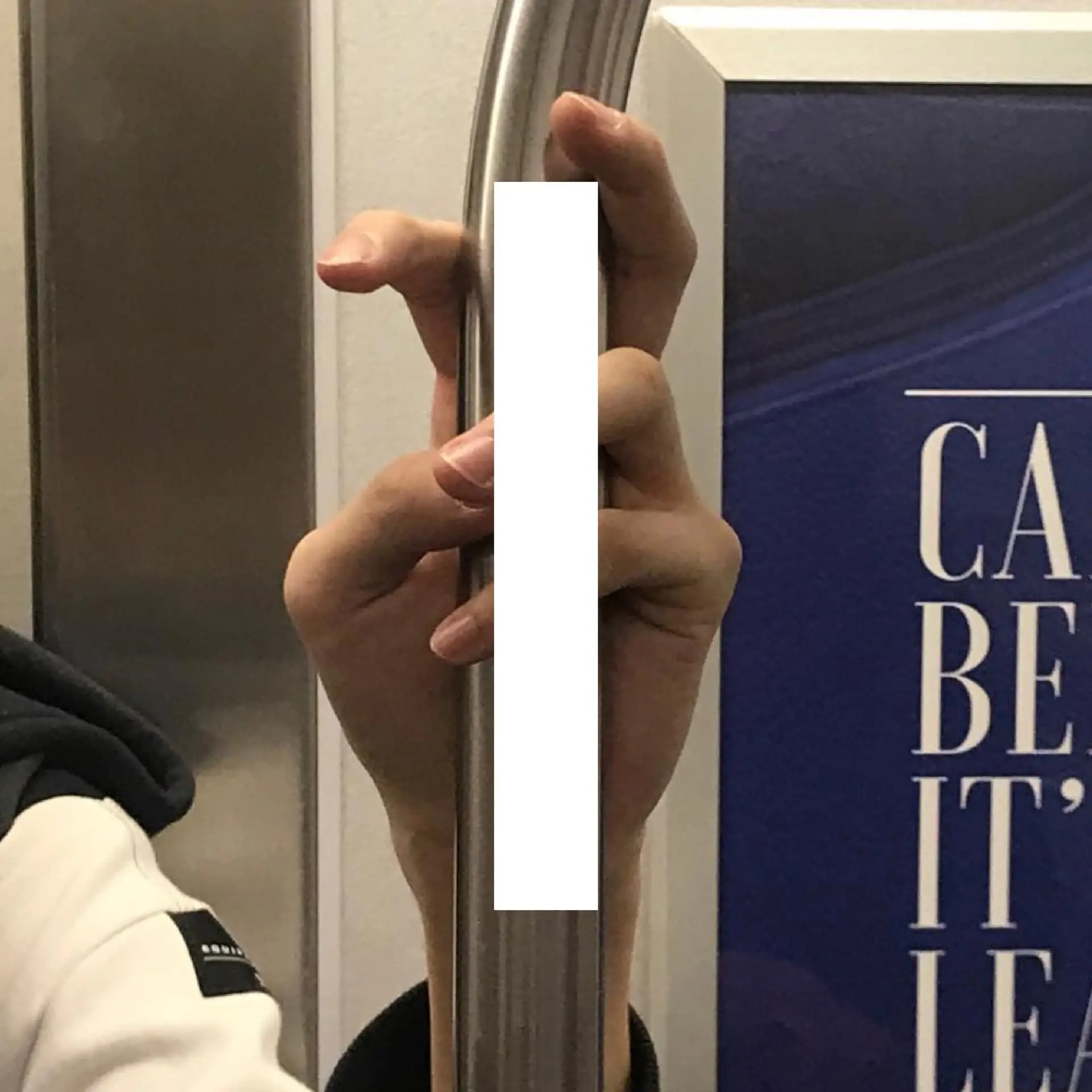 Book spread — fingers wrapped around pole